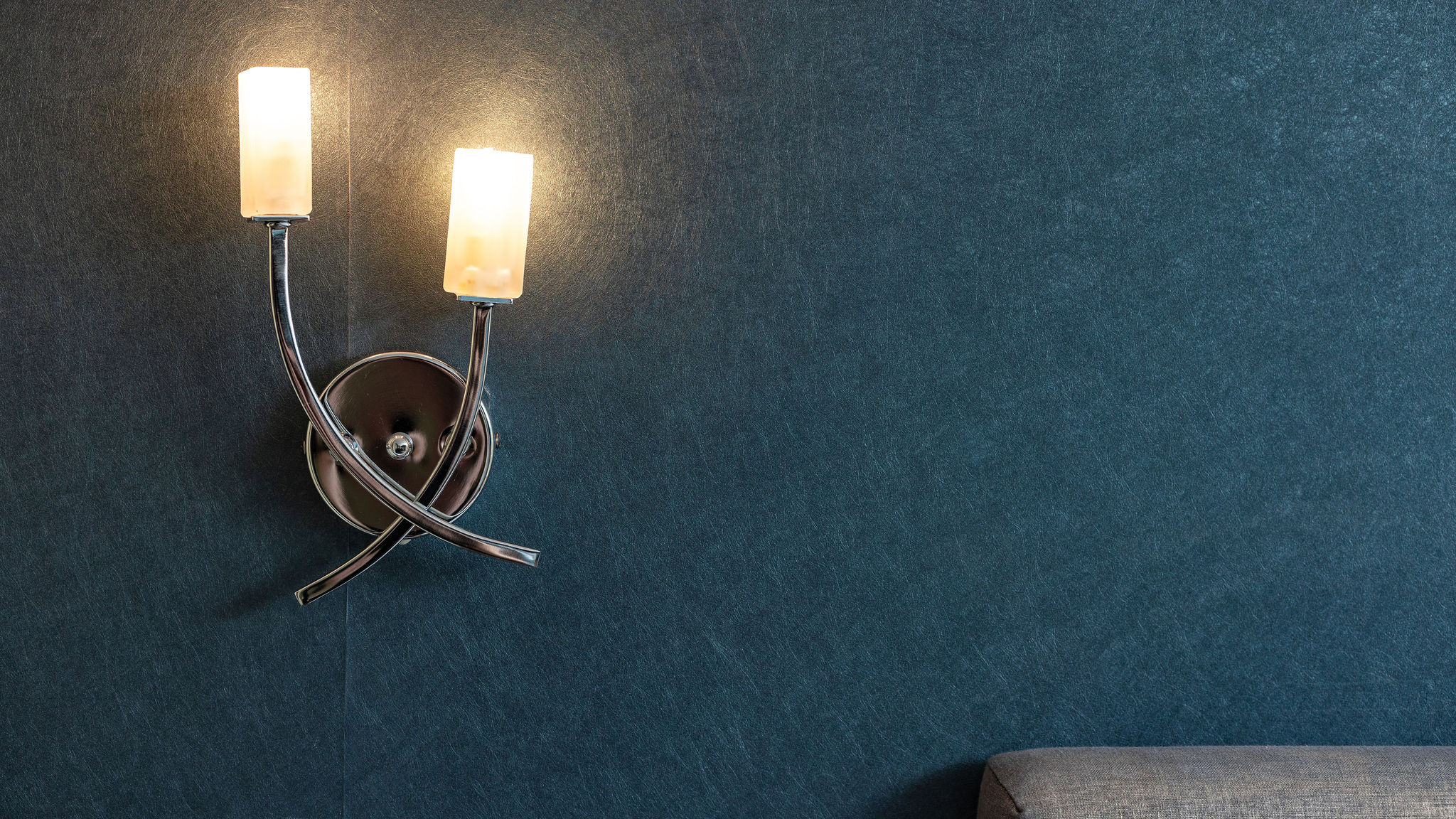 A wall lamp at dusk