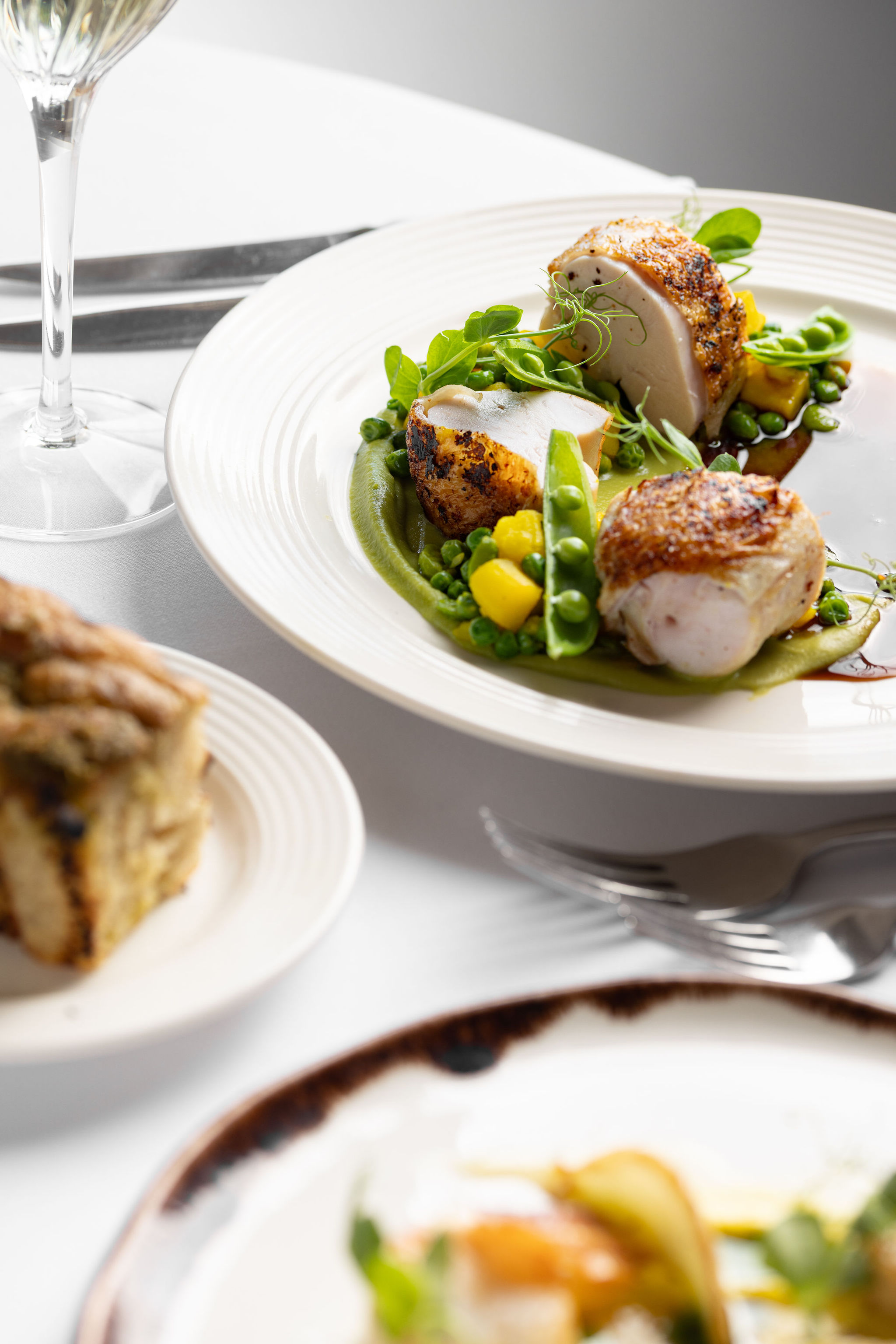 Chicken supreme with peas and bisque