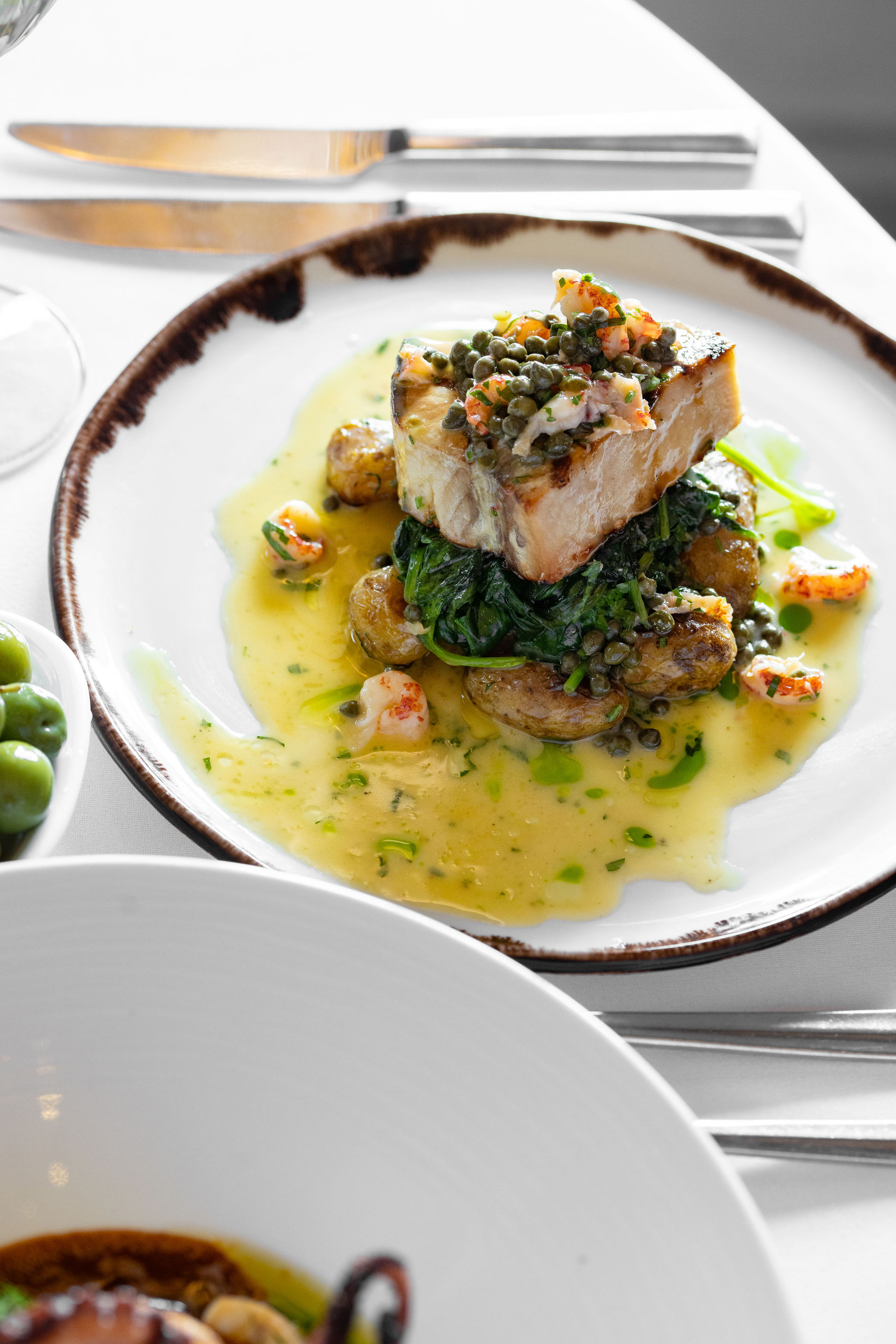 Pan-fried fish, capers and lemon