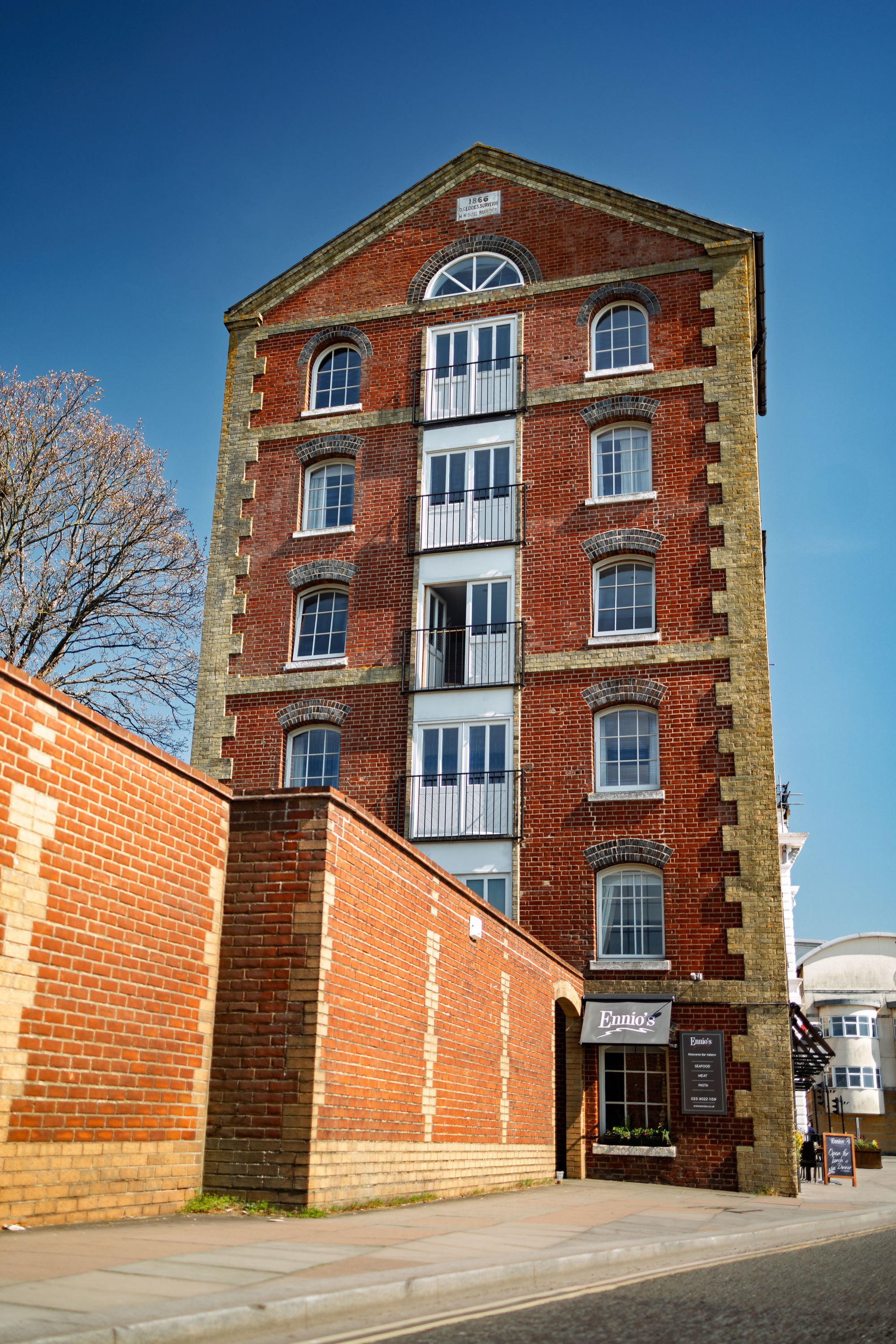 The Ennios building today: a six-storey red-brick Victorian warehouse on Town Quay, Southampton