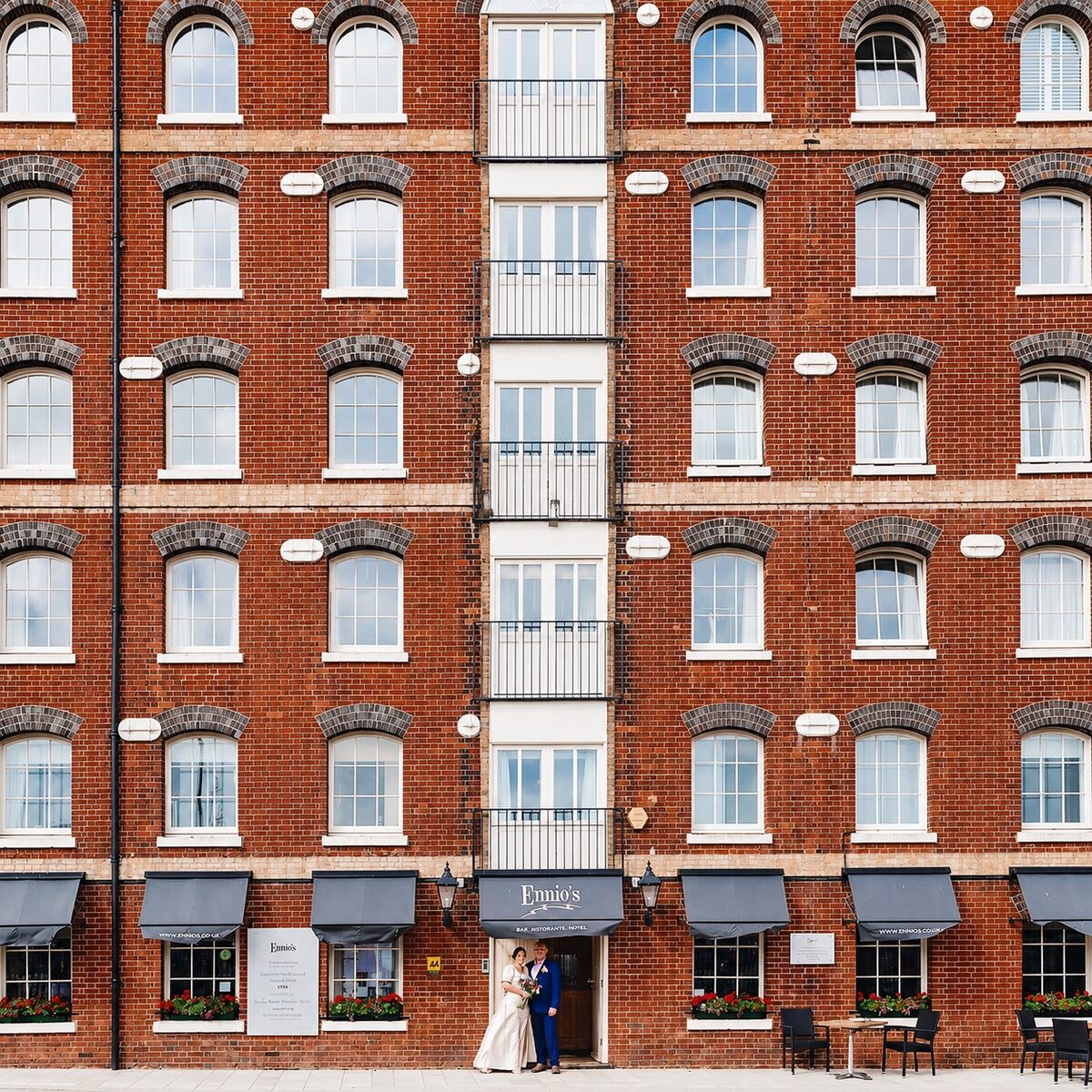 A wedding couple in front of Ennios, the Victorian warehouse on Town Quay