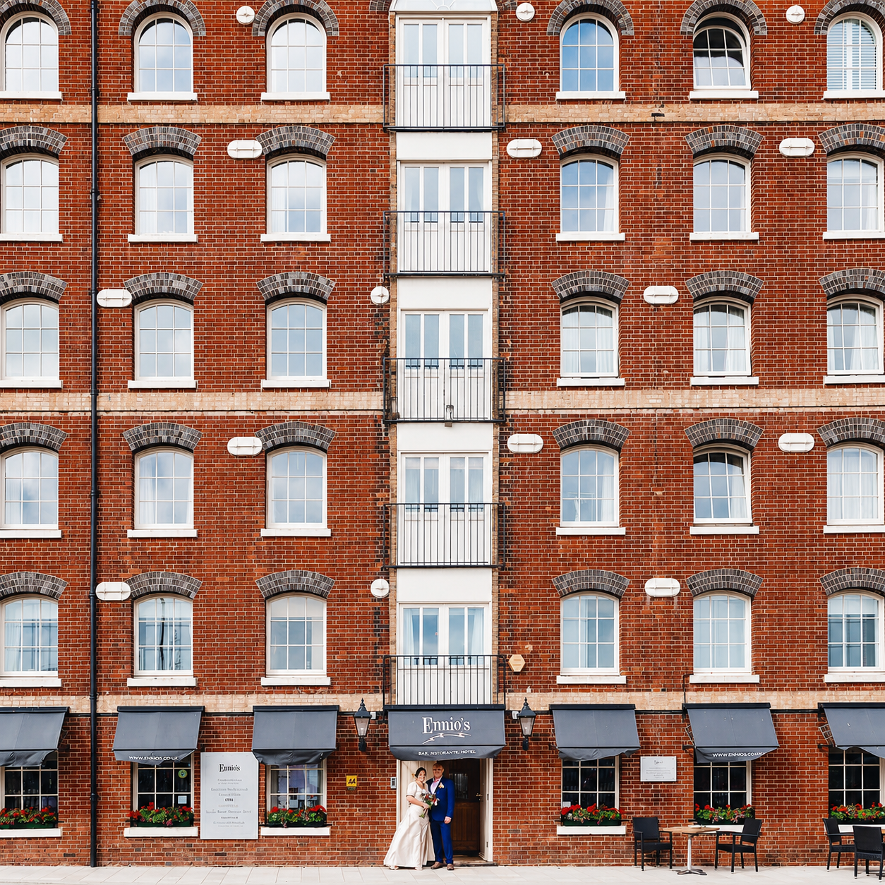 A wedding couple in front of Ennios, the Victorian warehouse on Town Quay